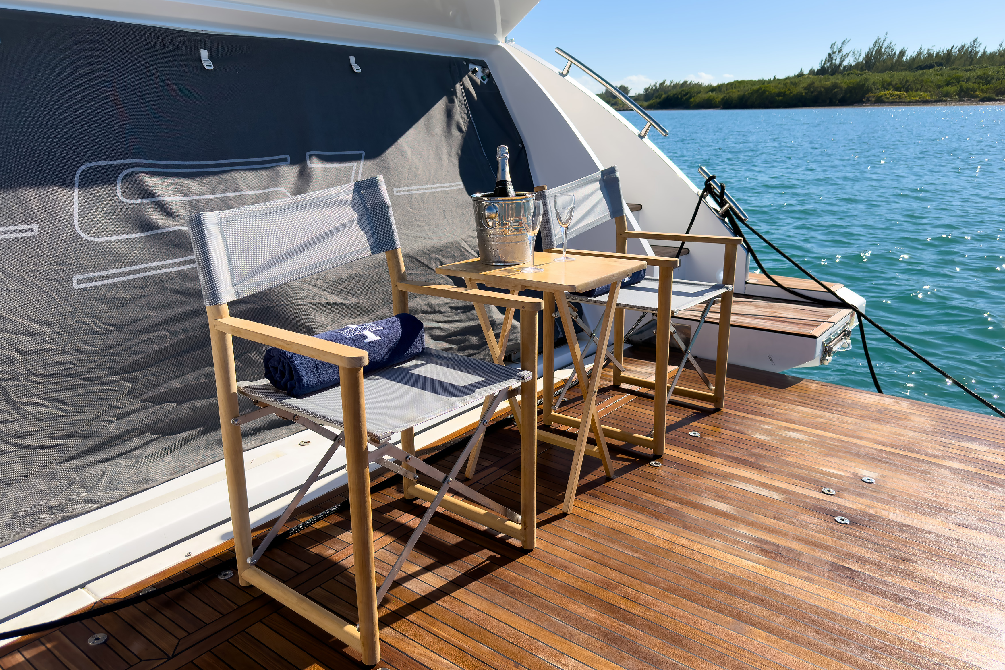 Aft deck lounge chairs with waterfront views