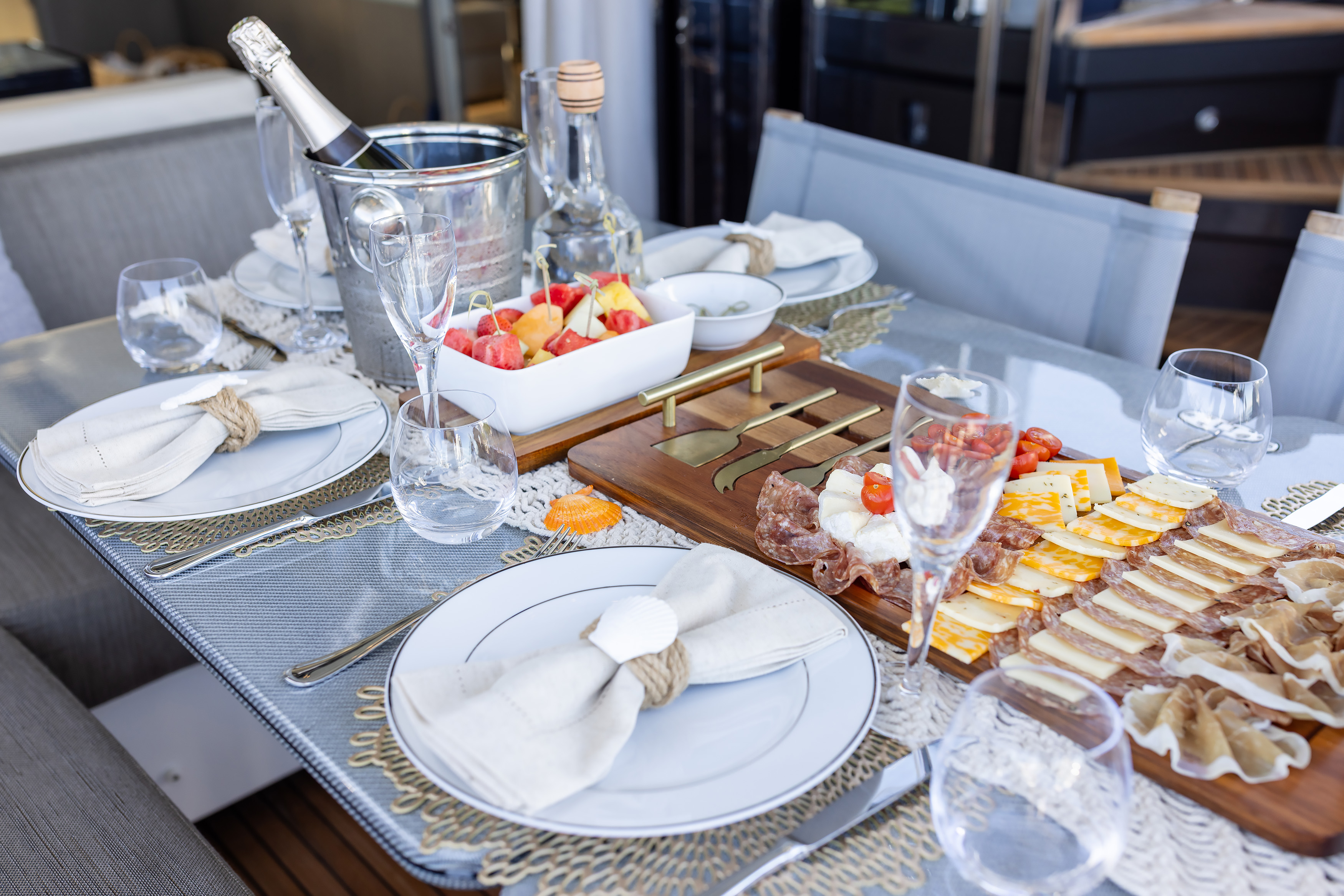 Champagne and serving boards with appetizers