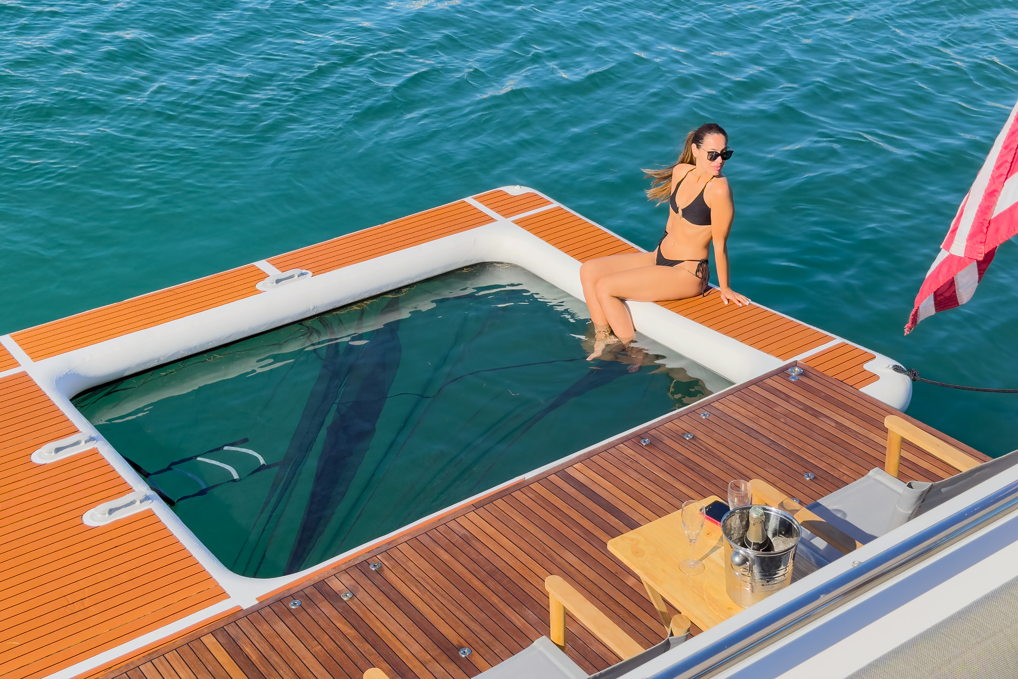 Swim platform with glass viewing area and clear water