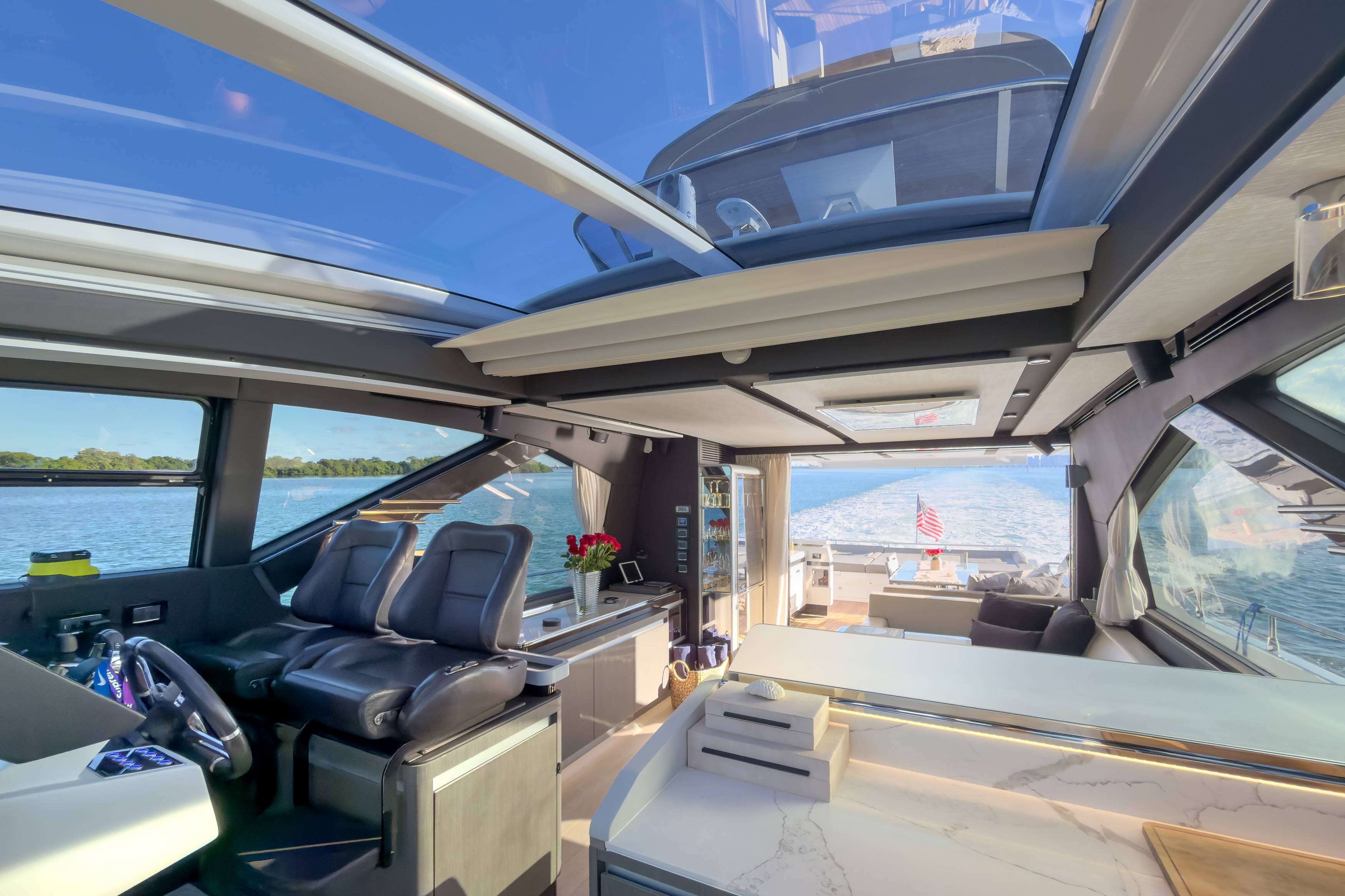 Indoor helm with glass retractable roof and dual captain seats