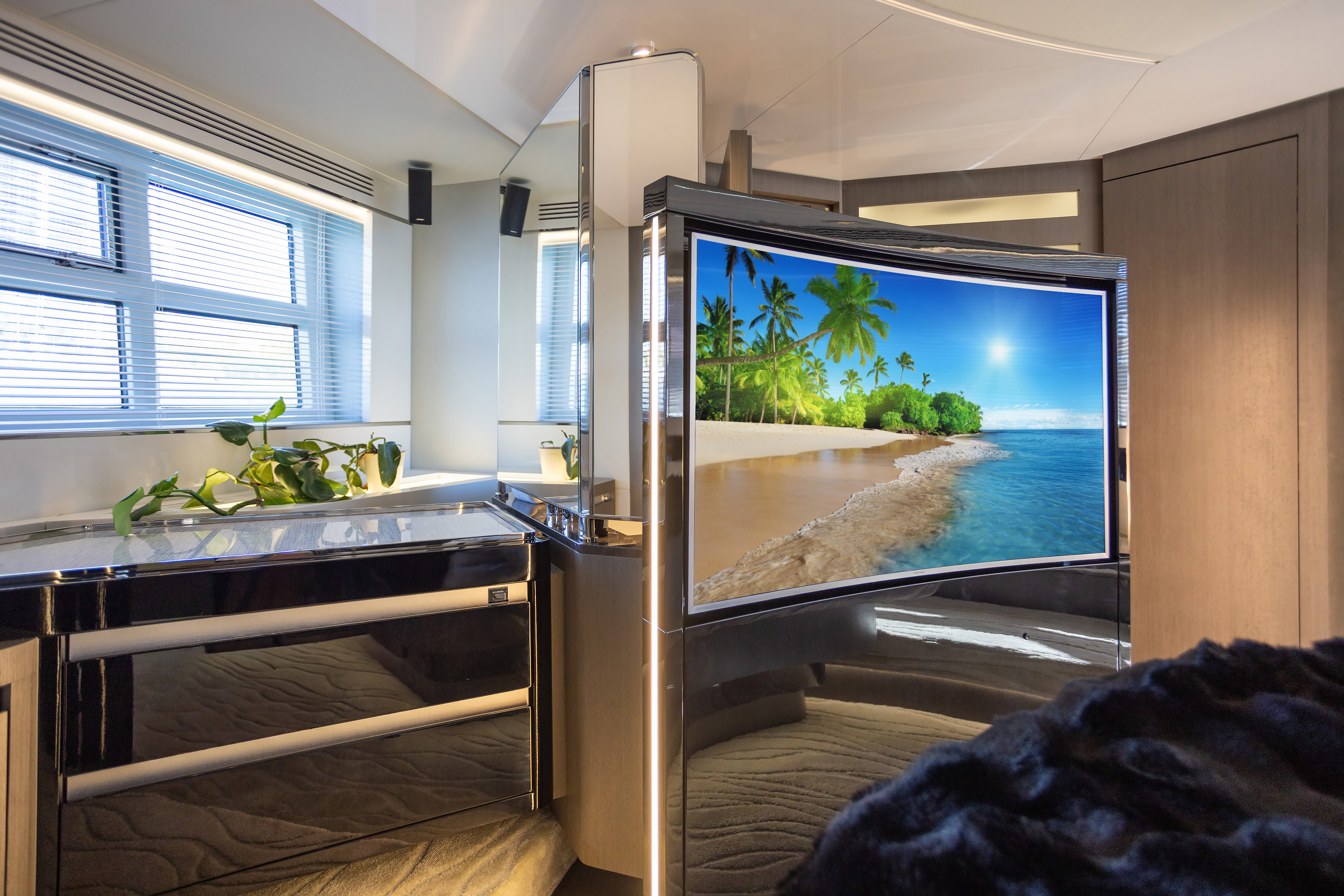 Master stateroom with swivel TV and vanity
